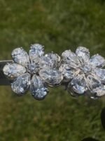 Flower earrings on grass, angled view - 4 CTW Pear-Shaped Lab-Grown Diamond Flower Earrings - 14K White Gold