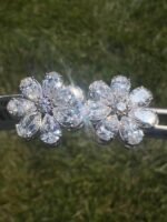 Close-up of flower earrings on grass - 4 CTW Pear-Shaped Lab-Grown Diamond Flower Earrings - 14K White Gold