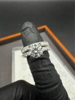 Close-up of diamond ring on finger - 6.10 CTW E VVS2 Round Diamond Ring – Solid 14K White Gold, IGI Certified Lab Created CVD
