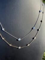 Solid 14K gold diamond by the yard necklace with 2.05-2.47 CTW lab-grown diamonds on a black bust, close view