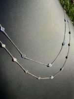 Solid 14K gold diamond by the yard necklace with 2.05-2.47 CTW lab-grown diamonds on a black bust, angled view